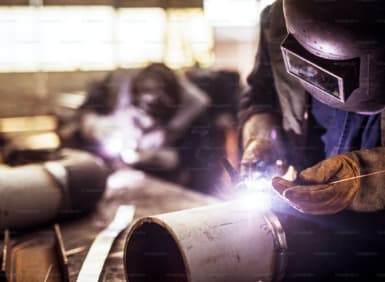 Welder working on structural steel